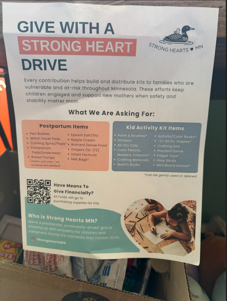 A sign requesting supplies to help the besieged in the Twin Cities area